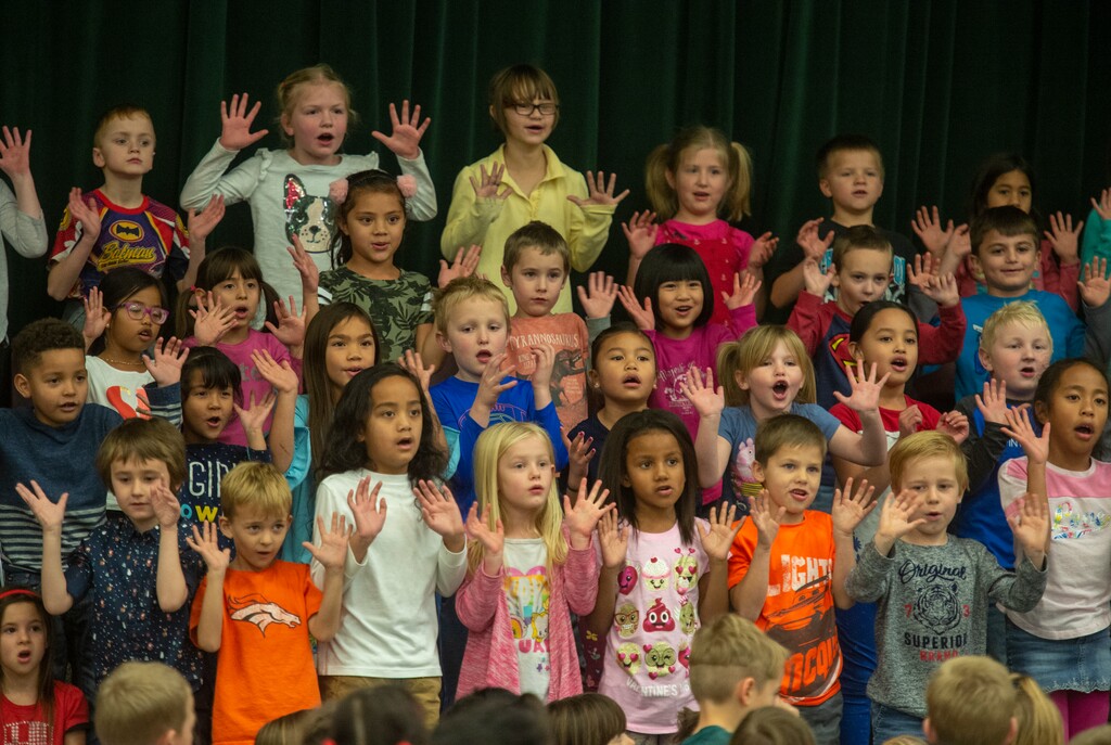 (Rick Egan  |  The Salt Lake Tribune)   Second graders sing during a Christmas assembly, before Ms. Worthington the principal, surprised all 650 students at her school with the gift-wrapped boxes of cereal, at Oquirrh Elementary in West Jordan, Thursday, Dec. 20, 2018.