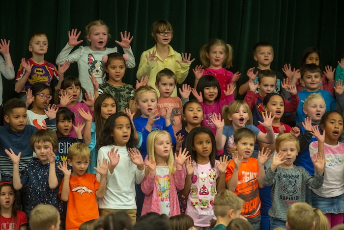 (Rick Egan  |  The Salt Lake Tribune)   Second graders sing during a Christmas assembly, before Ms. Worthington the principal, surprised all 650 students at her school with the gift-wrapped boxes of cereal, at Oquirrh Elementary in West Jordan, Thursday, Dec. 20, 2018.


