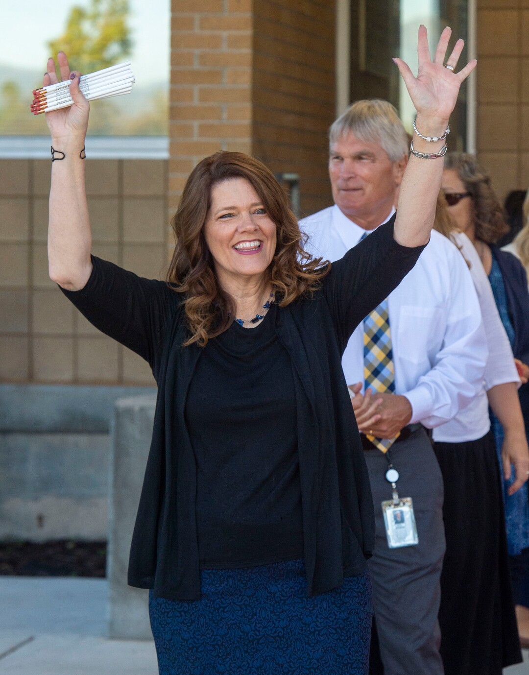 (Rick Egan  |  The Salt Lake Tribune)         Jeri Rigby, the new principal of Copperview Elementary School, cheers for her teachers and their students as they walk the red carpet on the first day of school, Monday, Aug. 19, 2019.