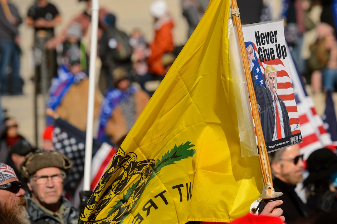 (Trent Nelson  |  The Salt Lake Tribune) A group of Trump supporters listens to speeches at the State Capitol in Salt Lake City on Wednesday, Jan. 6, 2021.