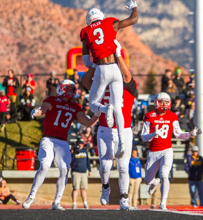 Southern Utah quarterback Patrick Tyler (3) celebrates scoring a rushing touchdown against Northern Arizona during an NCAA college football game Saturday, Nov. 18, 2017, in Cedar City, Utah. Southern Utah defeated Northern Arizona 48-20 to claim a share of the Big Sky Conference title. (Jordan Allred/The Spectrum via AP)
