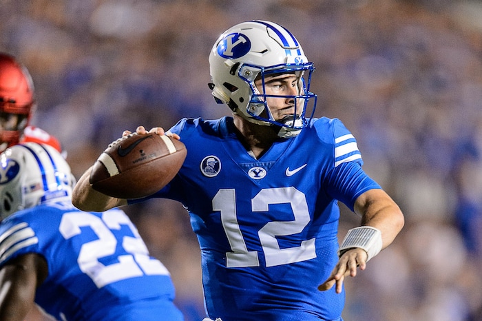 (Trent Nelson | The Salt Lake Tribune)  Brigham Young Cougars quarterback Tanner Mangum (12) throws as BYU hosts Utah, NCAA football in Provo, Saturday September 9, 2017.