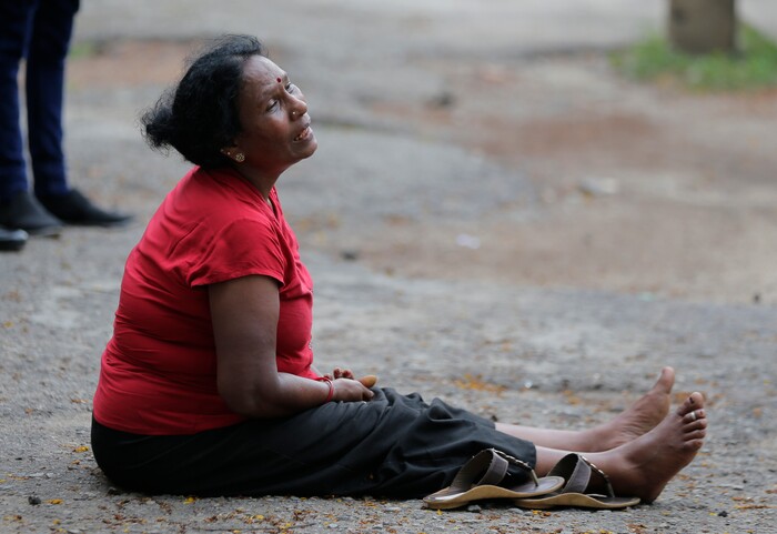 A relative of a blast victim grieves outside a morgue in Colombo, Sri Lanka, Sunday, April 21, 2019.  More than hundred were killed and hundreds more hospitalized with injuries from eight blasts that rocked churches and hotels in and just outside of Sri Lanka's capital on Easter Sunday, officials said, the worst violence to hit the South Asian country since its civil war ended a decade ago. (AP Photo/Eranga Jayawardena)