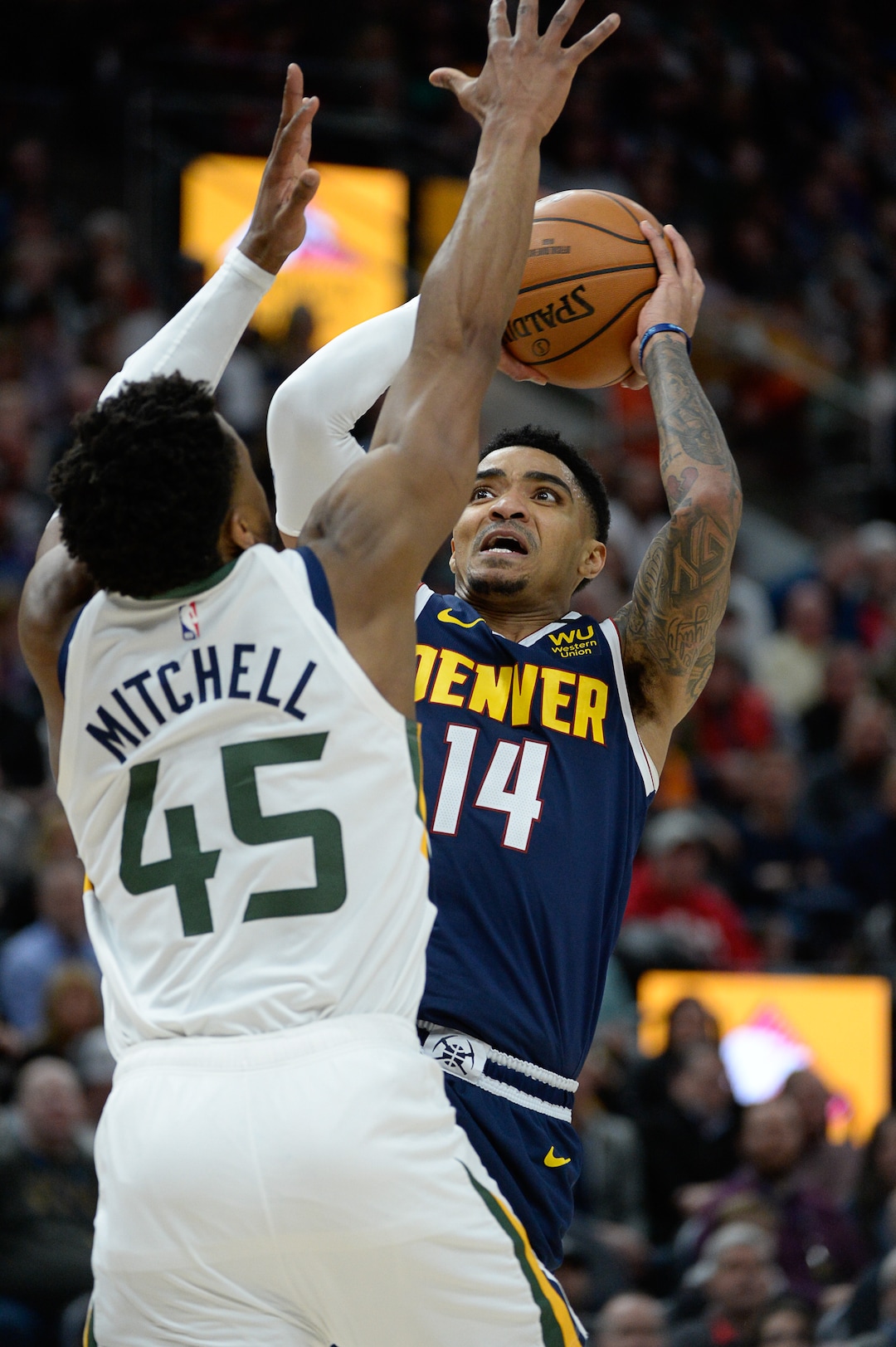 (Francisco Kjolseth  |  The Salt Lake Tribune) Utah Jazz guard Donovan Mitchell (45) tries to put the block on Denver Nuggets guard Gary Harris (14) as the Utah Jazz host the Denver Nuggets in their NBA basketball game at Vivint Smart Home Arena in Salt Lake City on Wednesday, Feb. 5, 2020.