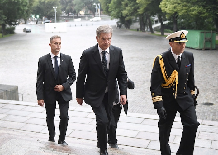 President of Finland Sauli Niinist, centre, arrives for a prayer service for stabbing victims at the Cathedral in Turku, Finland, on Friday evening, Aug. 18, 2017.  Several people were stabbed on the Market Square earlier Friday. (Vesa Moilanen/Lehtikuva via AP)
