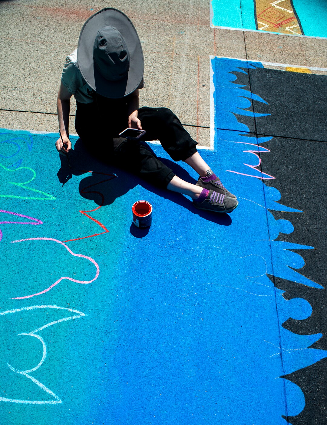 (Rick Egan  |  The Salt Lake Tribune)     Veronica Zac paints the letter ÒTÓ in the Black Lives Matter mural, on the south side of City Hall on Tuesday, Aug. 4, 2020.