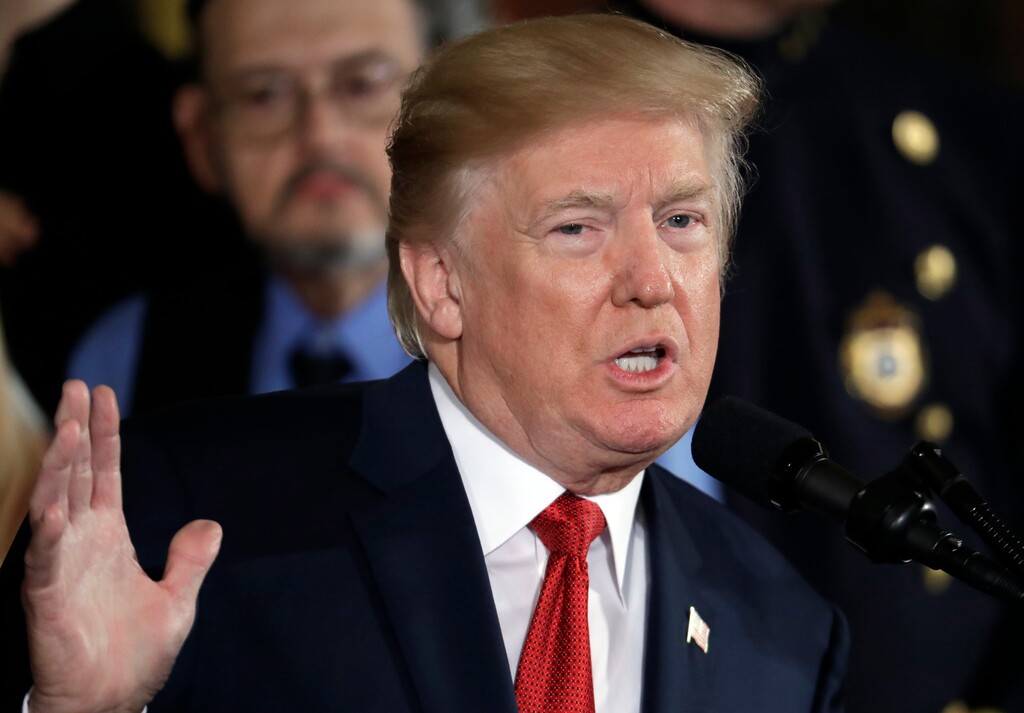 (AP Photo/Evan Vucci) In this Oct. 26, 2017, photo, President Donald Trump speaks during an event to declare the opioid crisis a national public health emergency in the East Room of the White House in Washington. Trump and Vice President Mike Pence came out recently with statements on opioids and humanitarian aid that appear big, bold and immediate. An AP Fact Check finds there’s less than meets the eye to them.