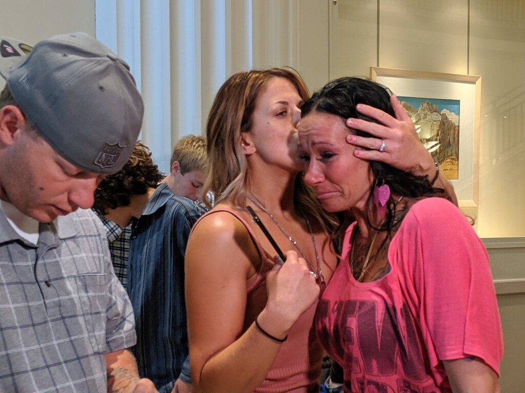 (Paighten Harkins | The Salt Lake Tribune) Theresa Toledo (right) is consoled Thursday, July 18, 2019, inside the lobby of the Salt Lake County District Courthouse after a disposition hearing for the teen who shot and killed her son, Jerrad Jacobsen. Police first thought Jacobsen shot himself, but his 15-year-old stepbrother later admitted to the shooting.