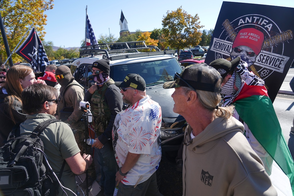 (Bethany Baker  |  The Salt Lake Tribune) Counterprotestors surround their vehicles as protesters engage with them during a "No Kings" rally at the Utah Capitol in Salt Lake City on Saturday, Oct. 18, 2025.