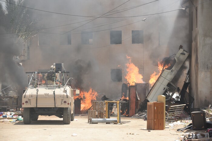(Photo courtest of Van Redin/National Geographic) On the set of “The Long Road Home.”