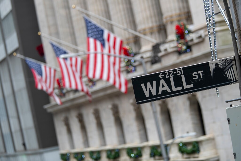(Mary Altaffer | AP file photo)

In this Jan. 3 photo, the Wall St. street sign is framed by U.S. flags flying outside the New York Stock Exchange in New York.