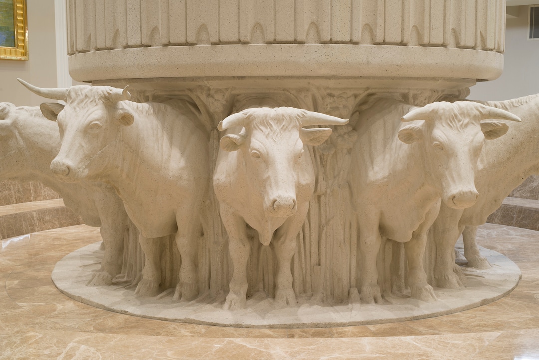 (photo courtesy LDS Church) Oxen under the baptismal font of the Jordan River Utah Temple. 