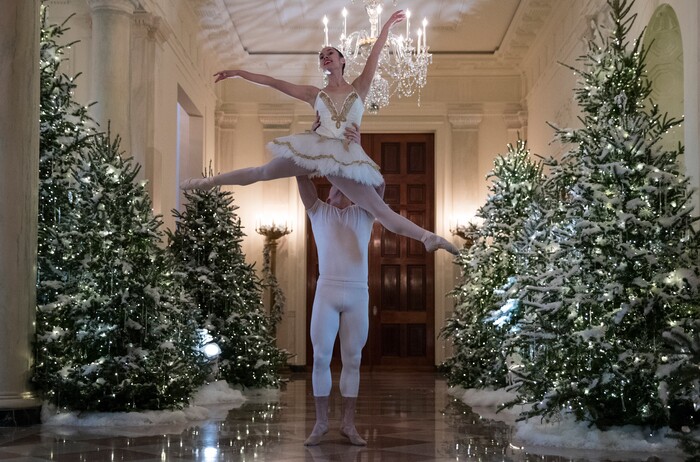 A ballerina is lifted during a performance of a piece from The Nutcracker among the 2017 holiday decorations in the Cross Hall of the White House in Washington, Monday, Nov. 27, 2017. (AP Photo/Carolyn Kaster)
