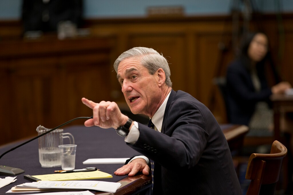 FILE - In this June 13, 2013 file photo, then-FBI Director Robert Mueller testifies on Capitol Hill in Washington. President Donald Trump’s closest allies are attacking the integrity of those involved in the widening probe of Russian interference in the U.S. election, accusing special counsel Mueller of driving a biased investigation. And Trump himself took aim at the senior Justice Department official responsible for appointing Mueller, accusing him on Twitter of leading a “Witch Hunt.”  (AP Photo/J. Scott Applewhite, File)