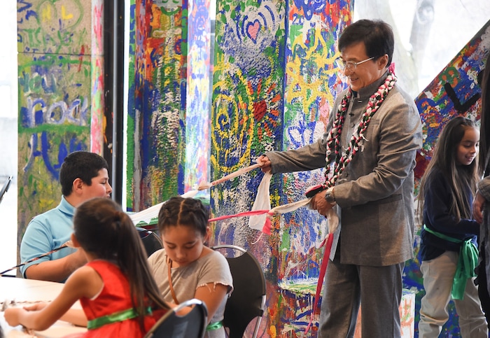 (Francisco Kjolseth | The Salt Lake Tribune) Jackie Chan meets with Mountain View Elementary students as they assemble jump ropes from recycled plastic during a preview of Jackie ChanÕs Inaugural Environmental Exhibition ÔJackie Chan: Green HeroÕ at The Leonardo: Museum of Creativity and Innovation on Thursday, Jan. 24, 2019.