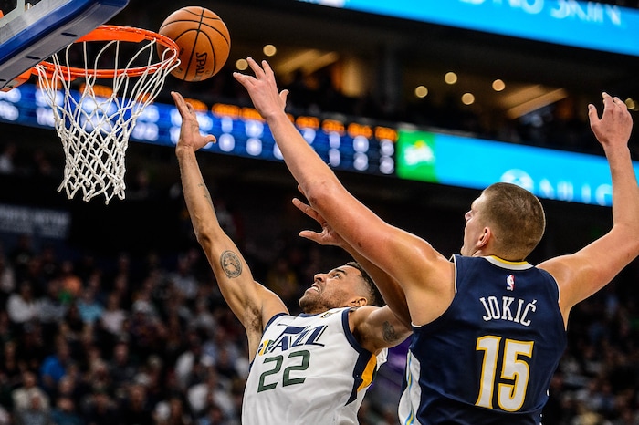 (Trent Nelson | The Salt Lake Tribune)  Utah Jazz forward Thabo Sefolosha (22) shoots ahead of Denver Nuggets center Nikola Jokic (15) as the Utah Jazz host the Denver Nuggets, NBA basketball in Salt Lake City, Wednesday October 18, 2017.