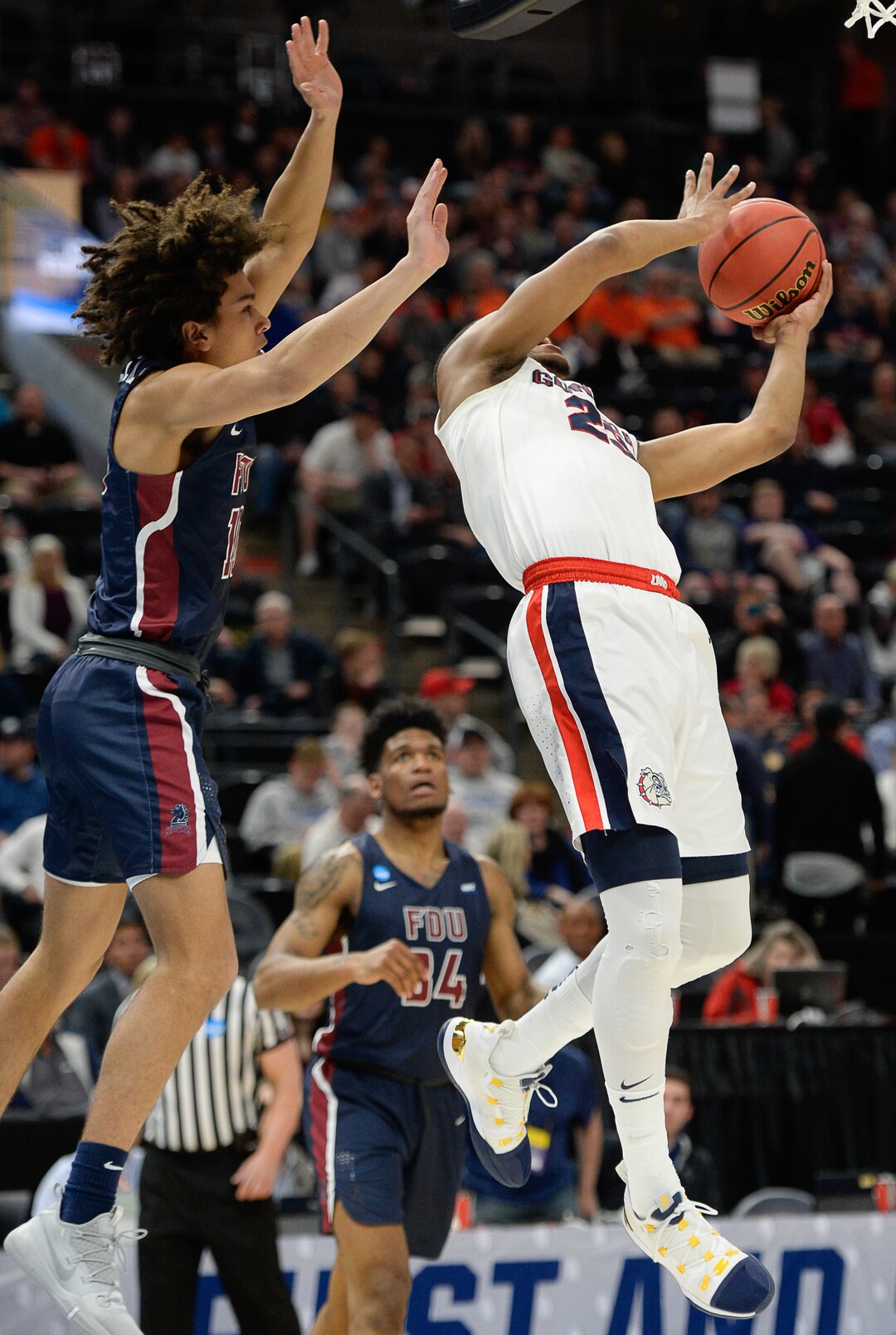(Francisco Kjolseth  |  The Salt Lake Tribune)  Fairleigh Dickinson Knights guard Brandon Powell (10) clothes lines Gonzaga Bulldogs guard Zach Norvell Jr. (23) as Gonzaga faces Fairleigh Dickinson in their first round menÕs NCAA March Madness tournament game at Vivint Smart Home Arena in Salt Lake City on Thursday, March 21, 2019.