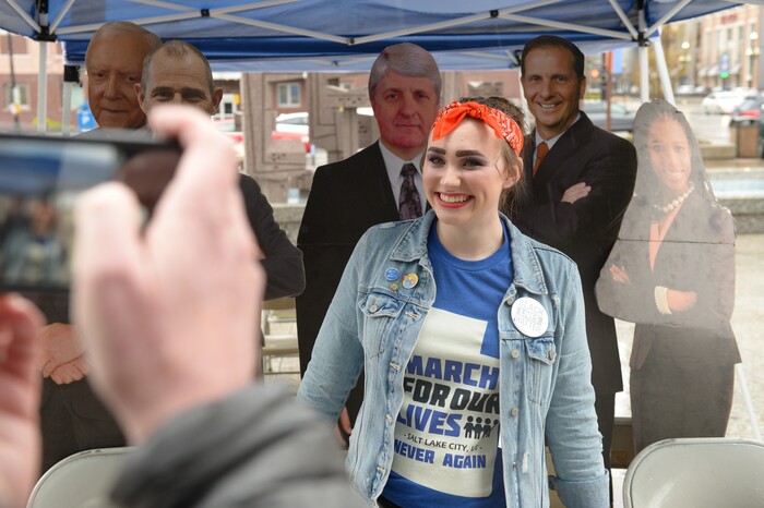 (Leah Hogsten | The Salt Lake Tribune) Hannah Wilkinson, a junior at Skyline High School poses in front of Utah's Congressmen and woman during a demonstration in support of gun reform at the Wallace F. Bennett Federal Building downtown during the #TownHallForOurLives march, Saturday, April 7, 2018, in response to a national call for town hall meetings issued by David Hogg, one of the leaders of the Parkland, FL #NeverAgain movement.