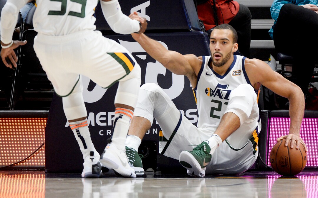 Leah Hogsten  |  The Salt Lake Tribune  Utah Jazz center Rudy Gobert (27) is helped to his feet after defensive play took him to the deck in the first half as the Utah Jazz take on the Atlanta Hawks, Feb. 1, 2019 at Vivint Smart Home Arena. 