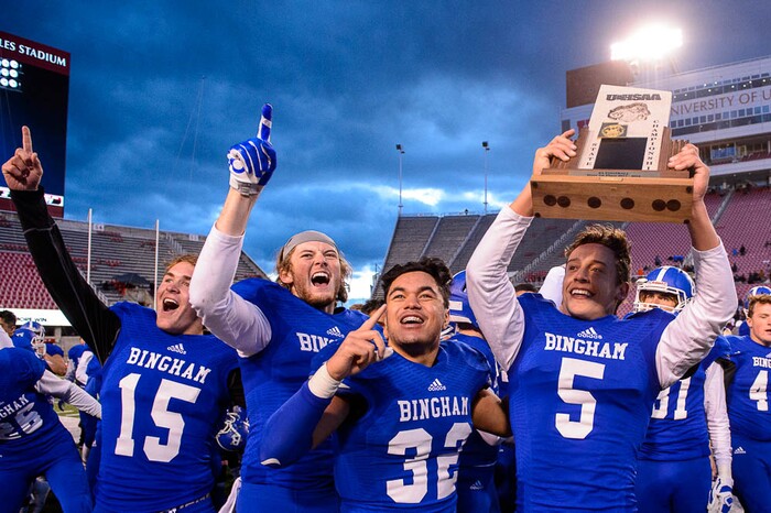(Trent Nelson | The Salt Lake Tribune)  Bingham players celebrate defeating East in the Class 6A High School State Football Championship game in Salt Lake City, Friday November 17, 2017. Bingham's Amoni Kaili (32) and Bingham's Dax Milne (5).