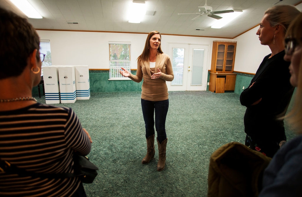 In this April 30, 2018, photo, Jena Jones, Director of the Short Creek Dream Center, guides a tour through the renovated facility, formally the home of polygamous sect leader Warren Jeffs in Hildale, Utah. The sprawling house surrounded by towering brick walls has been converted into a sober living center by Evangelical missionaries, the latest sign of the group’s dwindling control of the small community on the Utah-Arizona border. (Chris Caldwell/The Spectrum via AP)