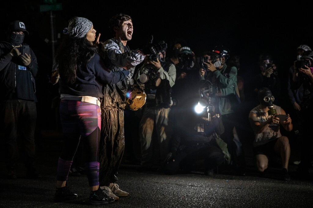 (Paula Bronstein | AP file photo)  A protester screams at police as they attempt to take control of the streets with Portland protests reaching 100 consecutive nights on Saturday, Sept. 5, 2020, in Portland, Ore.