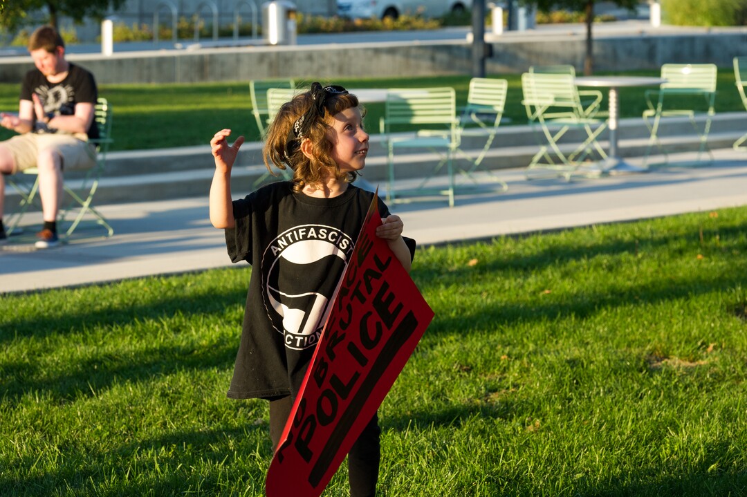 (Alex Gallivan | Special to the Tribune) Cleo Harris protests at an Emergency Rally hosted by Utah Against Police Brutality, in response to the arrest of U of U nurse Alex Wubbels. Wubbels was arrested by SLCPD Detective Jeff Payne after she refused to take blood from an unconscious patient, which is against hospital policy.