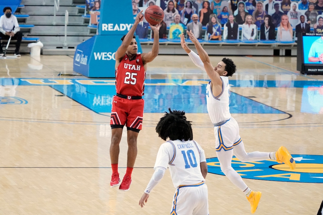 Utah guard Alfonso Plummer (25) shoots over UCLA guard Jules Bernard during the first half of an NCAA college basketball game Thursday, Dec. 31, 2020, in Los Angeles. (AP Photo/Marcio Jose Sanchez)