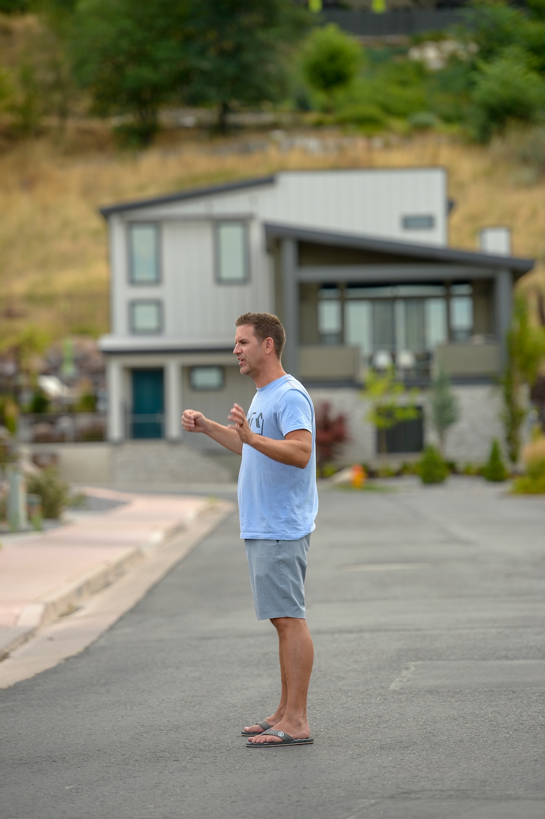 Leah Hogsten  |  The Salt Lake Tribune  Columbus Court resident Justin Peterson, who was holding a neighborhood pool party Tuesday, first yelled "Fire!" and immediately sprang into action with his neighbors to combat the grass fire in their neighborhood. Five people were injured and one home was damaged by a fast-moving grass fire on Columbus Court, Tuesday, July 24, 2018. Forty homes were evacuated as flames spread through about 100 acres. Between 50 and 60 firefighters responded to the fire.