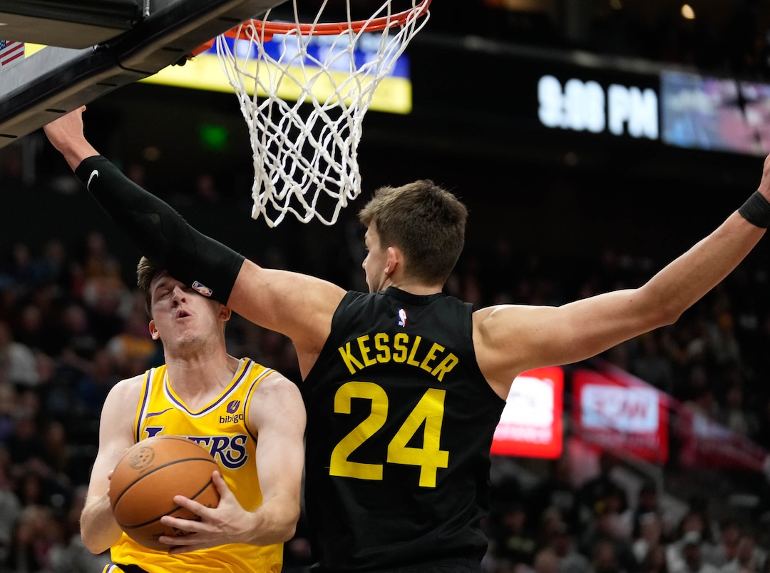 (Francisco Kjolseth  |  The Salt Lake Tribune) Los Angeles Lakers guard Austin Reaves (15) is defended by Utah Jazz center Walker Kessler (24) during an NBA basketball game Wednesday, Feb. 14, 2024, in Salt Lake City.