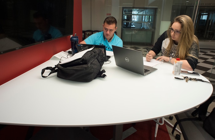 (Rick Egan  |  The Salt Lake Tribune)     Skyler Parker and Ryley Armer study in a study room at the new Gary and Ann Crocker Science Center at the University of Utah, Thursday, April 19, 2018.



