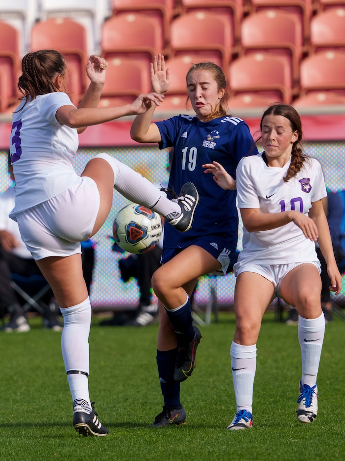(Leah Hogsten | The Salt Lake Tribune) Lehi's Ally Dahl (3) and Erin Dahl (10) pressure Skyline's Annie Boyden (19) during the 5A State Soccer Championship game on Friday. Skyline High School defeated Lehi High School, 3-1 to win the 5A Championship title Oct. 22, 2021 at Rio Tinto Stadium.
