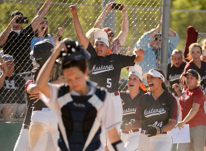 (Trent Nelson | The Salt Lake Tribune)
Herriman players celebrate a win over Syracuse in the 6A Softball State Championship game, Thursday May 24, 2018.