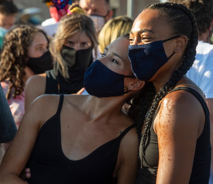 (Rick Egan  |  The Salt Lake Tribune)     Ballet West dancers Chelsea Keefer and Jazz Bynum are sprayed with water to cool down after performing a special dance on State Street in Salt Lake City, during the Dance Dance Revolution protest for racial equality, on Sunday, Aug. 9, 2020.