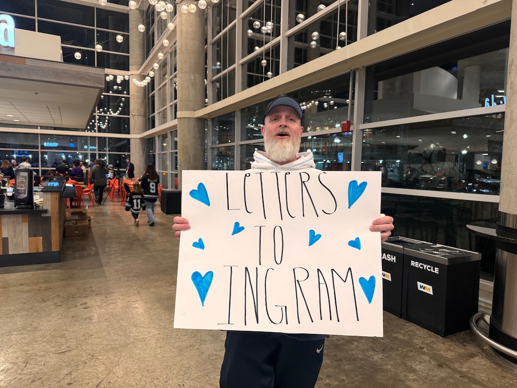 (Belle Fraser | The Salt Lake Tribune) A Utah Hockey Club fan holds a sign on the Delta Center concourse encouraging fans to write letters to goaltender Connor Ingram on Wednesday, March 12, 2025.