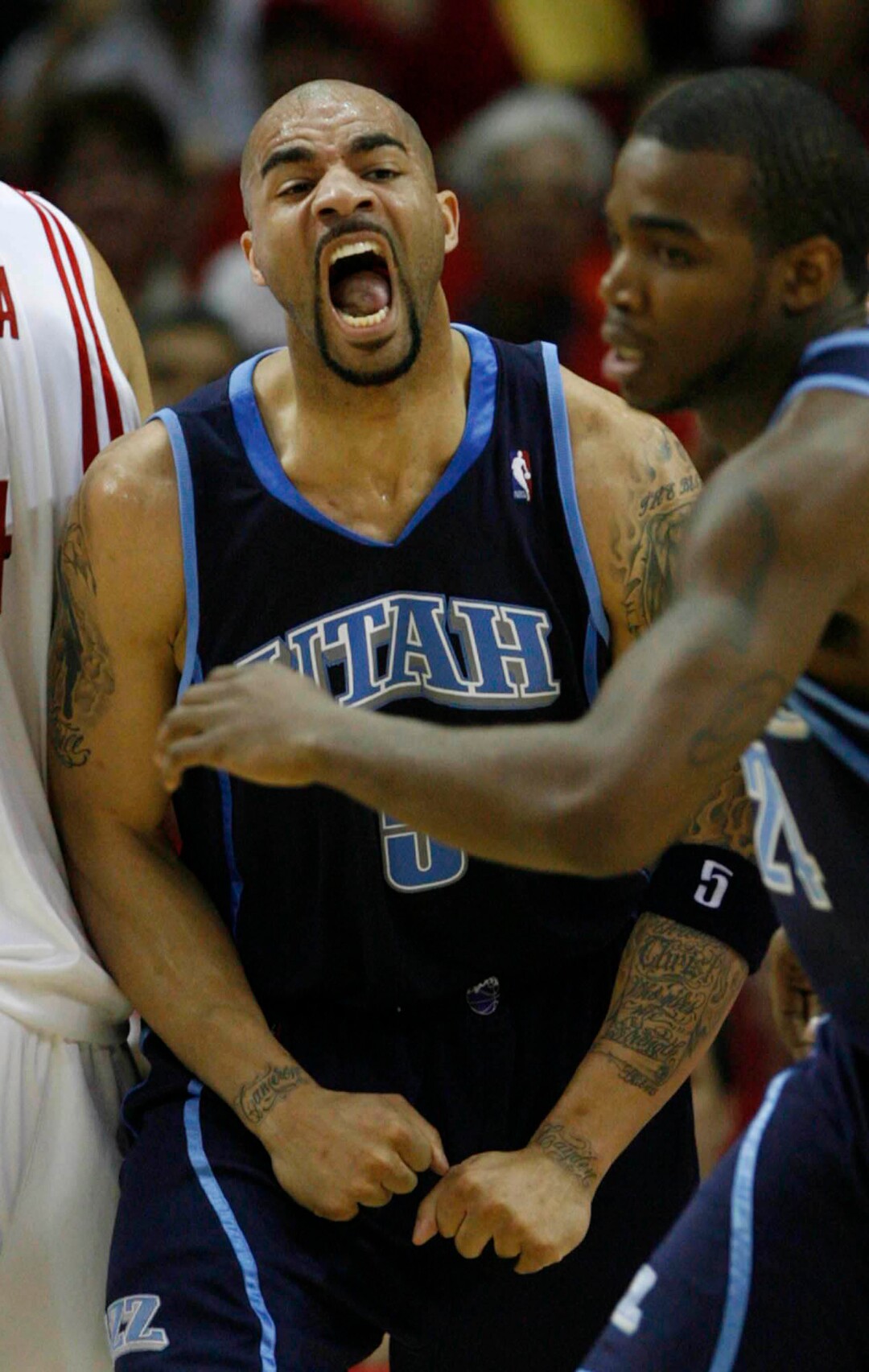 (Trent Nelson  |  Tribune file photo) Utah Jazz forward Carlos Boozer lets out a yell after scoring against the Rockets in the 2008 playoffs.