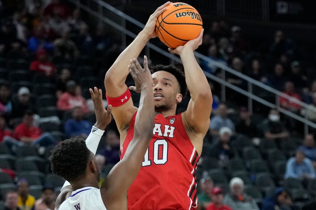 Utah's Marco Anthony (10) shoots against Washington during the first half of an NCAA college basketball game in the first round of the Pac-12 tournament Wednesday, March 9, 2022, in Las Vegas. (AP Photo/John Locher)