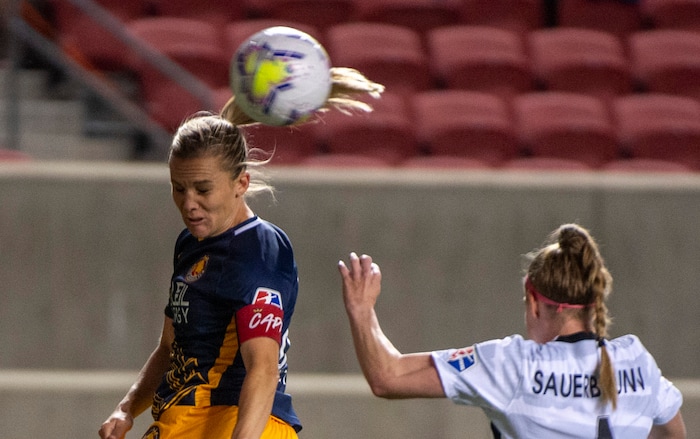 (Rick Egan | The Salt Lake Tribune) Utah Royals FC forward Amy Rodriguez (8) heads the ball as Portland Thorns FC defender Becky Sauerbrunn (4) defender Becky Sauerbrunn (4) defends, in soccer action between Utah Royals FC and Portland Thorns FC at Rio Tinto Stadium, on Saturday, Oct. 3, 2020.