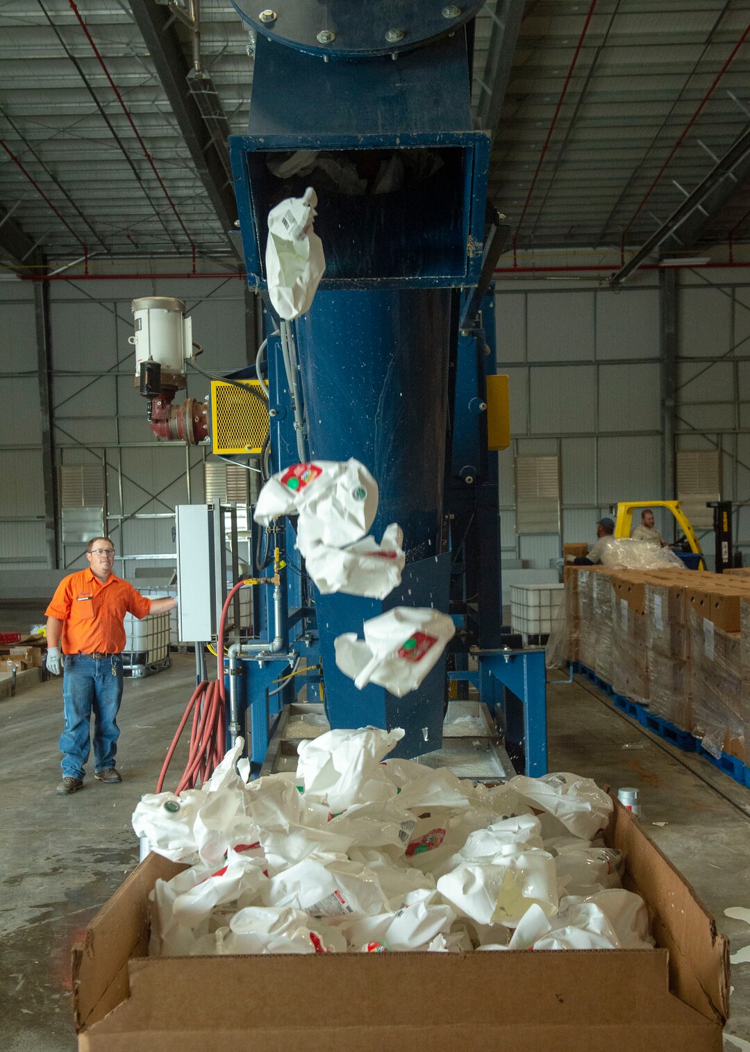(Rick Egan  |  The Salt Lake Tribune)   Empty milk containers come out of the de-bottling machine at Wasatch Resource Recovery in North Salt Lake.  Friday, May 24, 2019.