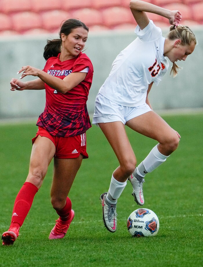 (Leah Hogsten | The Salt Lake Tribune) Mountain Crest's Summer Sofonia leaps to block Crimson Cliffs' Kate Young during the 4A State Soccer Championship game between Mountain Crest High School and Crimson Cliffs High School, Oct. 22, 2021 at Rio Tinto Stadium. Mountain Crest defeated Crimson Cliffs 1-0 in double overtime.