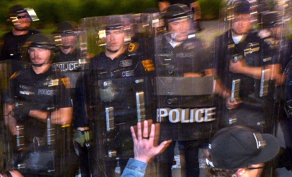 (Leah Hogsten  |  The Salt Lake Tribune)   Hundreds march in downtown Salt Lake City overturning two police cars and setting them on fire on Saturday, May 30, 2020, to protest the death of George Floyd, who died earlier this week after a Minneapolis police officer knelt on his neck.