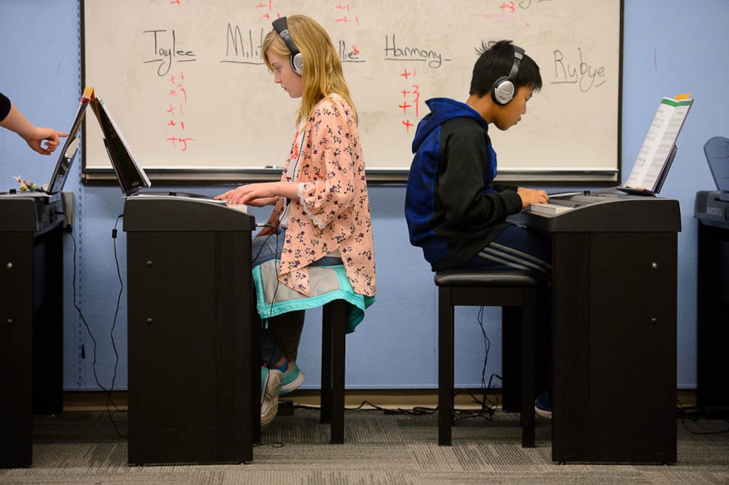 (Trent Nelson | The Salt Lake Tribune) Taylee Randall and Christian Takluem in an after school piano class at Salt Lake City's Bennion Elementary, which might be closing due to low enrollment. The school district is holding a meeting  Tuesday Feb. 19, 2019 to discuss the issue and hear from parents.
