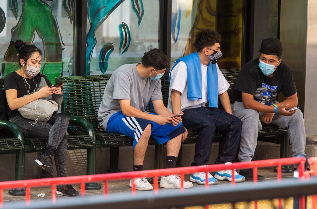 (Rick Egan  |  The Salt Lake Tribune) People wear masks as they wait for a TRAX train on Main Street in downtown Salt Lake City, on Thursday, Sept. 24, 2020.