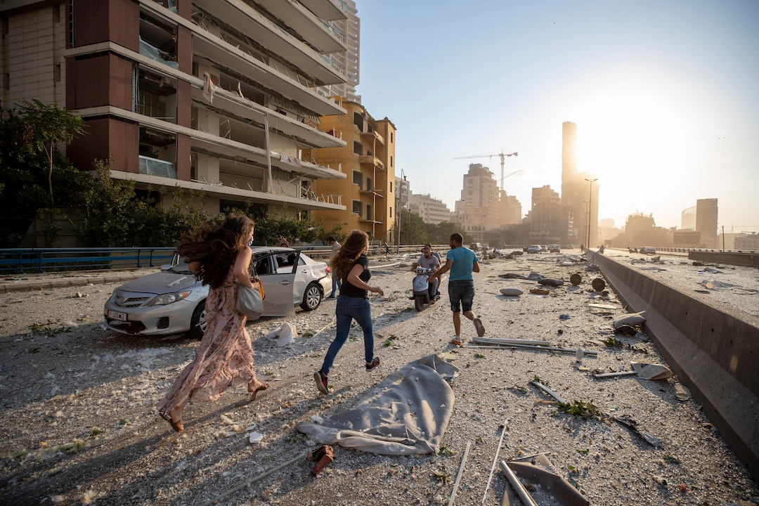 Aftermath of a massive explosion is seen in in Beirut, Lebanon, Tuesday, Aug. 4, 2020. Massive explosions rocked downtown Beirut on Tuesday, flattening much of the port, damaging buildings and blowing out windows and doors as a giant mushroom cloud rose above the capital. Witnesses saw many people injured by flying glass and debris. (AP Photo/Hassan Ammar)