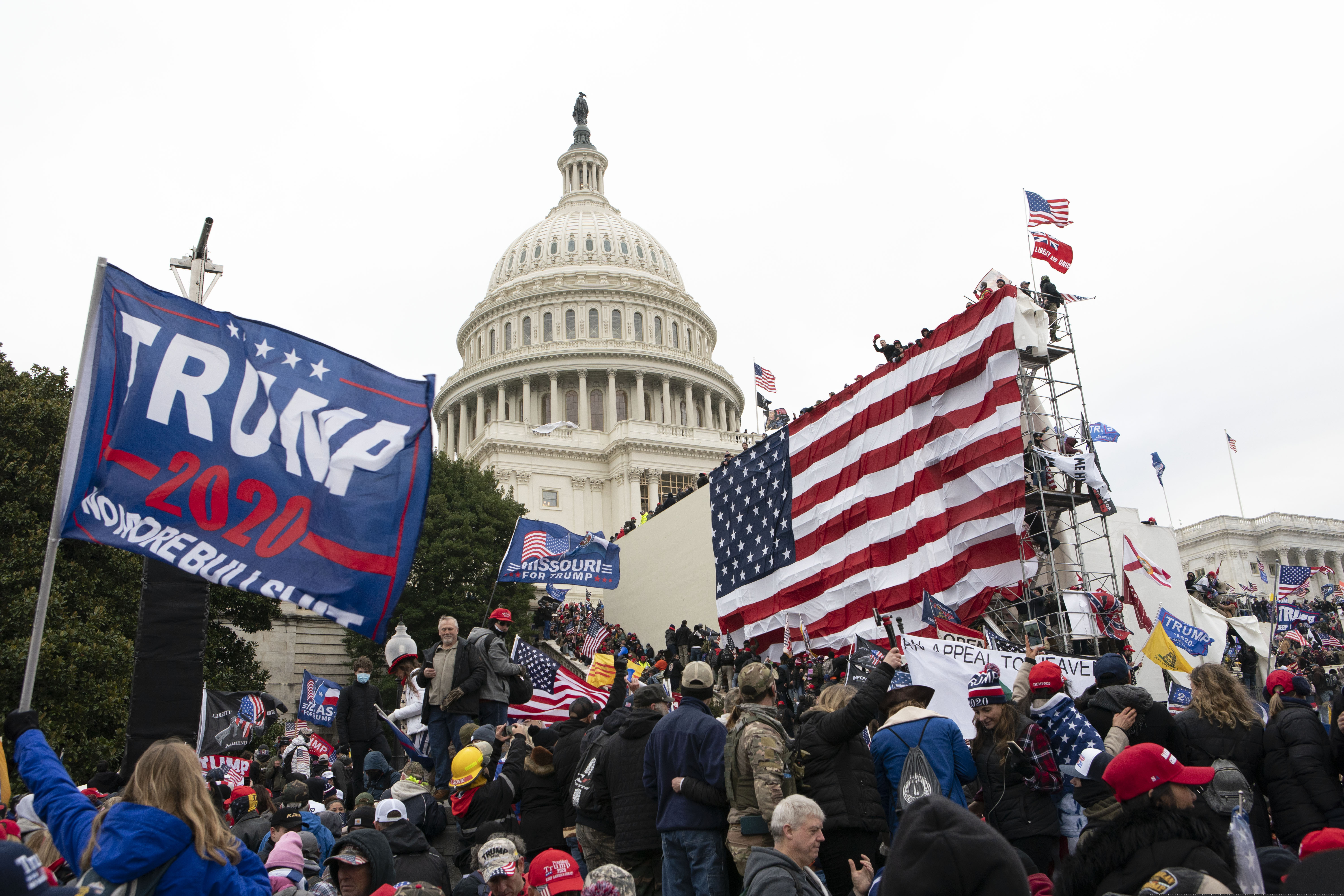 FILE - In this Jan. 6, 2021, file photo, supporters of President Donald Trump stand outside the U.S. Capitol in Washington. Black activists are coming out strongly against a growing narrative among conservatives that equates last week’s deadly siege on the U.S. Capitol to last summer’s Black Lives Matter protests over racial injustice.(AP Photo/Jose Luis Magana, File)