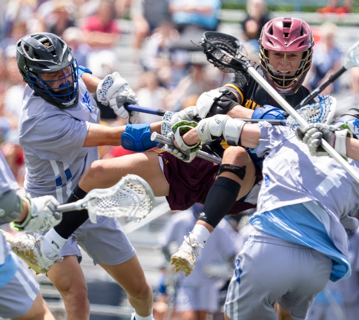 (Rick Egan | The Salt Lake Tribune) Abe Salmon, Viewmont, collides with Pleasant Grove defenders, in the Division C championship game between the Viewmont Vikings and the Pleasant Grove Vikings, in Layton, on Saturday, May 29, 2021.