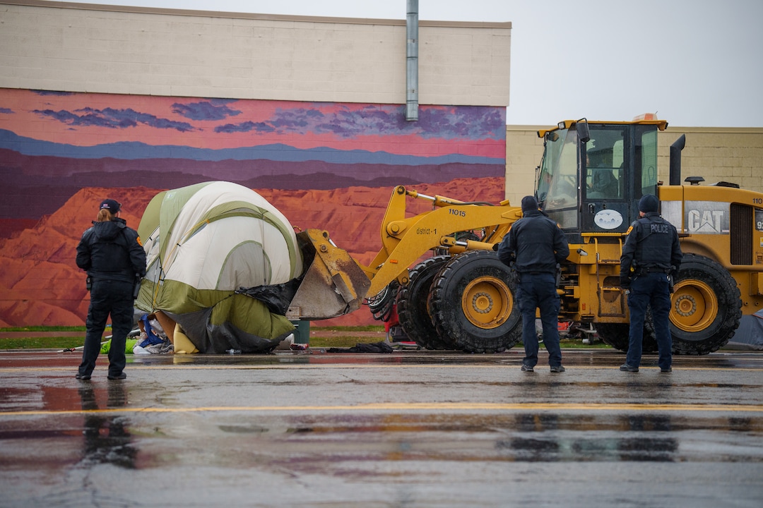 (Trent Nelson  |  The Salt Lake Tribune) Salt Lake County conducts a camp cleanup at the Fleet Block Murals in Salt Lake City on Wednesday, April 14, 2021.