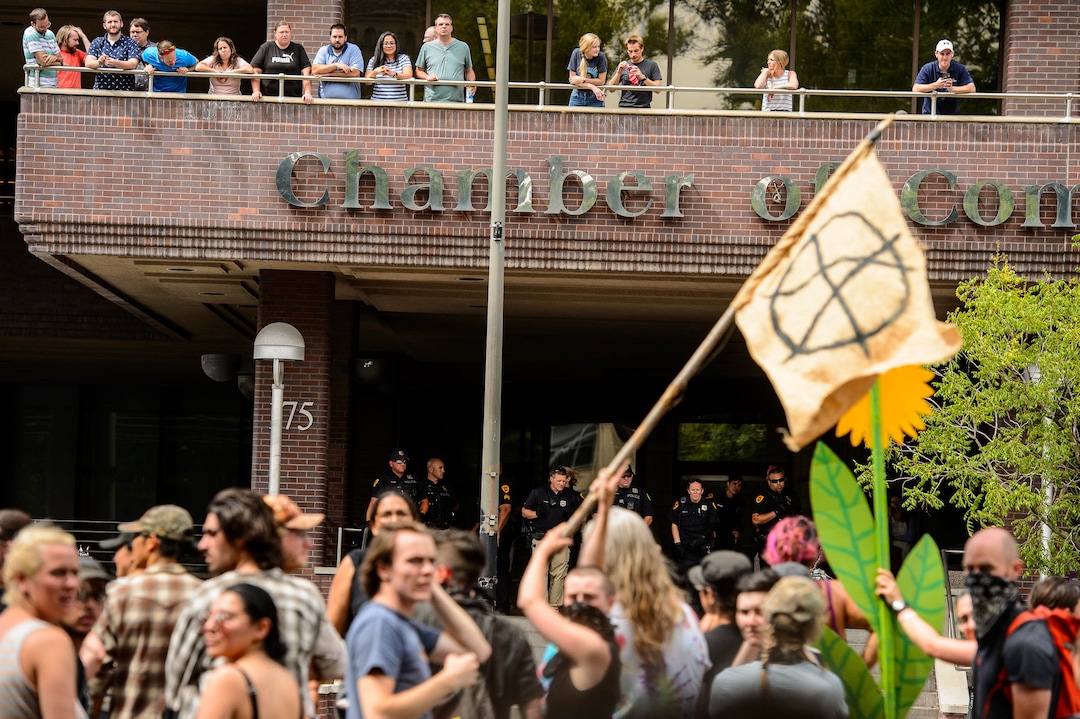 (Trent Nelson  |  The Salt Lake Tribune)  
An anarchy flag on 400 South after protesters occupied the Chamber of Commerce Building in Salt Lake City on Tuesday, July 9, 2019. Dozens of people showed up to protest the proposed Inland Port and ended up clashing with police, resulting in temporary street closures and arrests.