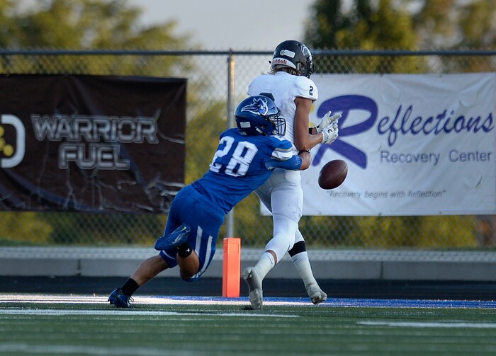 (Scott Sommerdorf | The Salt Lake Tribune) Corner Canyon WR Jakob Johnston drops a TD pass as Vikings DB Kainoa Maldonado forces the drop during first half play. Corner Canyon led Pleasant Grove 14-3 at the half, Friday, August 18, 2017.