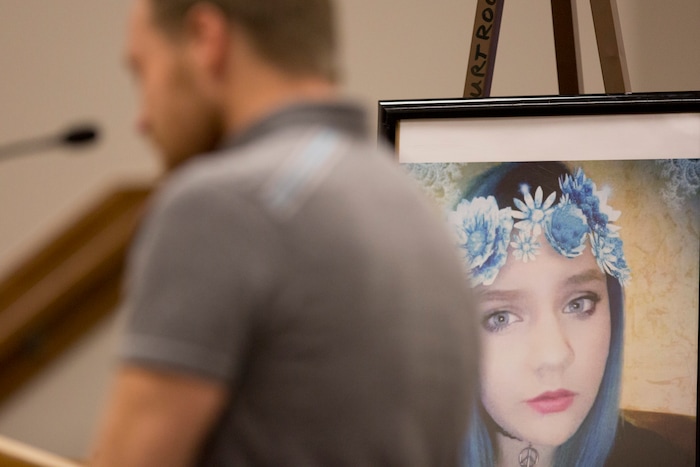 A photo of Jchandra Brown is pictured behind Dustin Lewis, the older brother to Brown, during Tyerell Przybycien's sentencing in the 4th District Court on Friday, Dec. 7, 2018, in Provo.